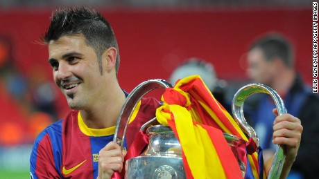 Barcelona&#39;s Spanish forward David Villa celebrates with the trophy at the end of the UEFA Champions League final football match FC Barcelona vs. Manchester United, on May 28, 2011 at Wembley stadium in London.Barcelona won 3 to 1. AFP PHOTO / LLUIS GENE (Photo credit should read LLUIS GENE/AFP/Getty Images)