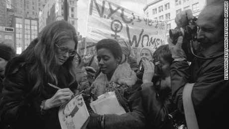 (Original Caption) Rep. Bella Abzug, (D-N.Y.), feminist Gloria Steinem and Lt. Gov. Maryann Krupsak of New York (L-R) chat with the marchers and newsmen in midtown Manhattan prior to the start of the International Women&#39;s Day March. Some 2,000 women from all walks of life joined the solidarity march in which they demanded full economic political, legal, sexual and racial equality and the right to control their own lives and bodies.