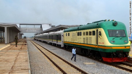 A man walks past a train of the newly completed Abuja-Kaduna night railway line in Abuja, on July 21, 2016.
Nigerias first high speed rails system which connects federal capital city Abuja and northern commercial capital Kaduna is set to begin commercial operations as President Muhammadu Buhari will inaugurate operation on July 26. The 186.5 km standard gauge track built by the China Railway Construction Corporation has double lines. The Abuja-Kaduna route has nine stations and the train can travel at up to 150km per hour. / AFP / STRINGER        (Photo credit should read STRINGER/AFP/Getty Images)