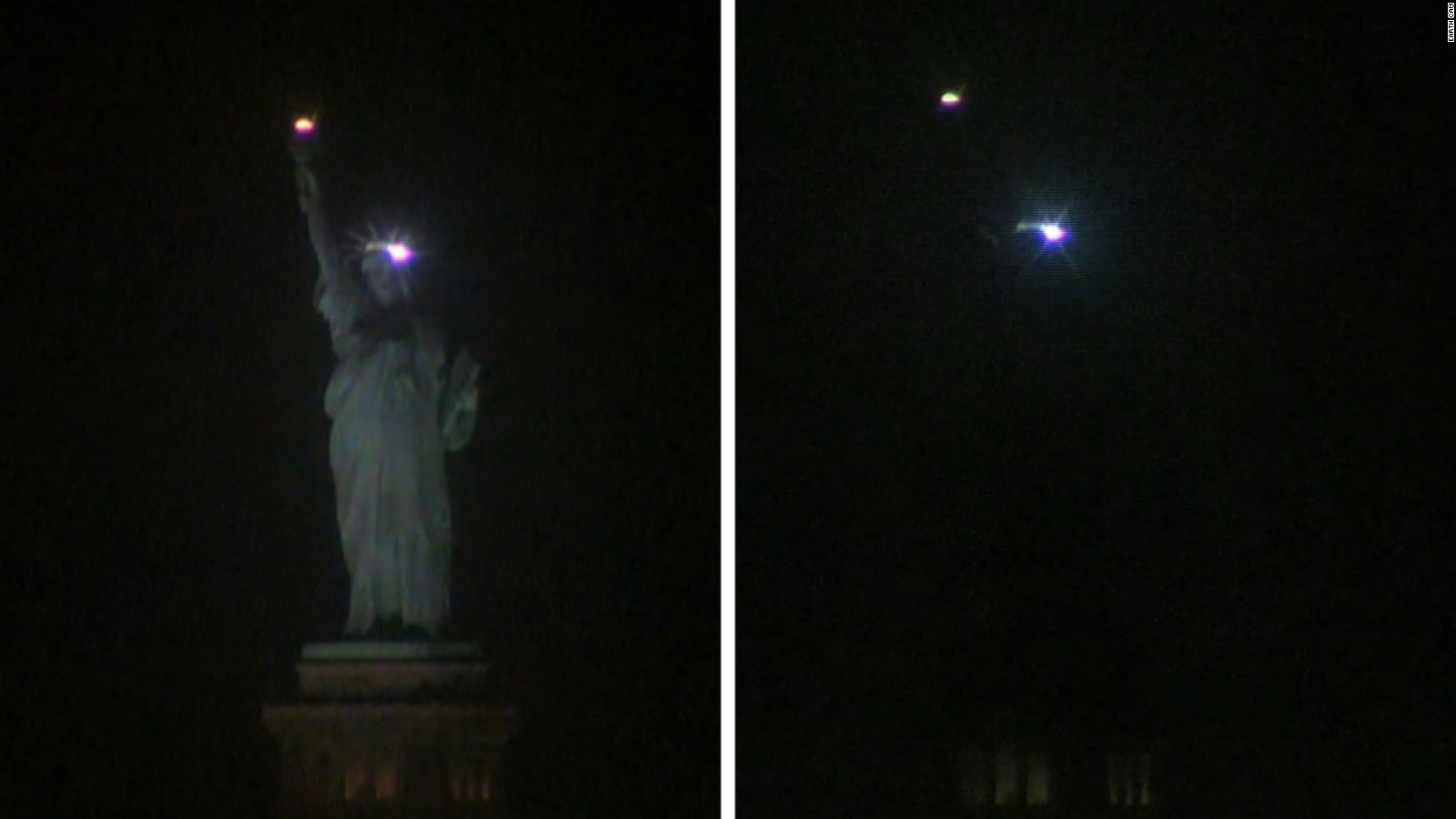 Image result for Statue of Liberty goes dark, lights up