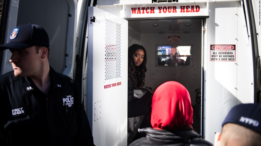Activist Tamika Mallory sits in the back of a police van after being detained for blocking traffic outside the Trump International Hotel and Tower in New York. &quot;Many of our national organizers have been arrested in an act of civil disobedience,&quot; &lt;a href=&quot;https://twitter.com/womensmarch/status/839558787753263104&quot; target=&quot;_blank&quot;&gt;tweeted the Women&#39;s March organization.&lt;/a&gt; &quot;We will not be silent.&quot;