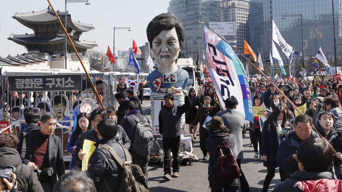An effigy of Park is paraded through the streets of Seoul.