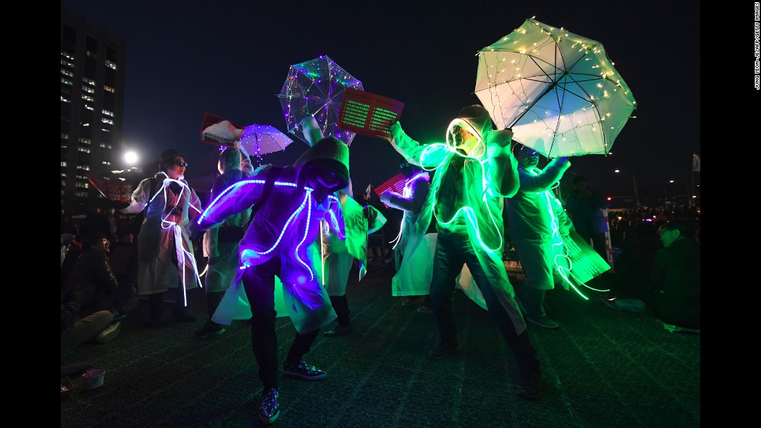Demonstrators wearing illuminated costumes take part in a rally demanding Park&#39;s arrest. Now stripped of her immunity, Park is vulnerable to prosecution in the scandal that triggered her removal. Lawmakers and judges agreed that she abused her authority in helping a friend raise donations from companies.