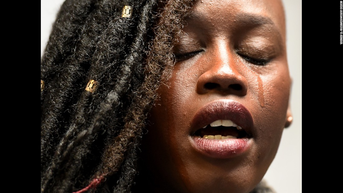 Elizabeth Arjok, a Sudanese immigrant, sheds a tear Monday, March 6, as she speaks before the start of a news conference by the New York Immigration Coalition. &lt;a href=&quot;http://www.cnn.com/2017/03/06/politics/trump-travel-ban-iraq/index.html&quot; target=&quot;_blank&quot;&gt;A revised travel ban&lt;/a&gt; was signed earlier that day by US President Donald Trump. The executive order, which temporarily stops immigration from six countries and reinstates a ban on all refugees, &quot;breaks my heart,&quot; Arjok said at the news conference. She fled the war in Sudan when she was 7, &lt;a href=&quot;http://www.wnyc.org/story/3-stories-new-yorkers-affected/&quot; target=&quot;_blank&quot;&gt;according to radio station WNYC.&lt;/a&gt;