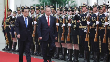 Chinese Premier Li Keqiang (left) accompanies Israeli Prime Minister Benjamin Netanyahu inside the Great Hall of the People in Beijing on March 20, 2017.