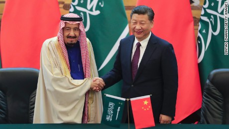 Chinese President Xi (R) shake hands with Saudi Arabia&#39;s King Salman in the Great Hall of the People on March 16, 2017 in Beijing.