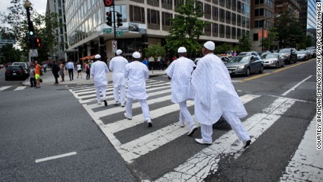 The Ooni of Ife is escorted across 17th Street near the White House June 22, 2016 in Washington, DC. His Majesty is keen to visit as many places as possible to &quot;connect the dots&quot; between Nigerian cultural heritage and the rest of the world. 
