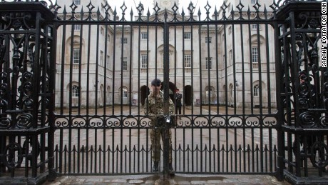 A soldier chains the gate at Horse Guards after Wednesday&#39;s terror attack. The entrances to Downing Street and Buckingham Palace were also closed as precautions.