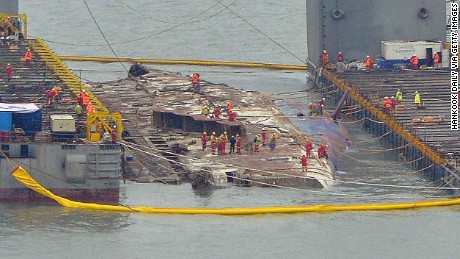 South Korea: Sewol ferry emerges from the water 3 years after sinking - CNN