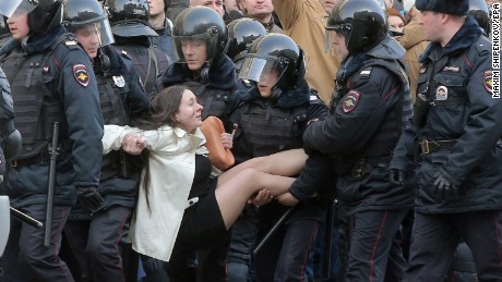 This image of Russian riot police detaining a demonstrator has been widely shared on social media.