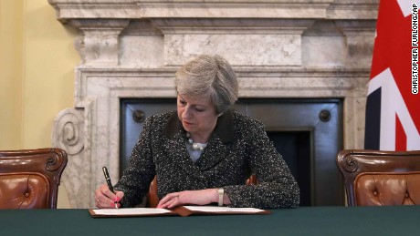 UK Prime Minister Theresa May signs the official letter invoking Article 50 on March 29.