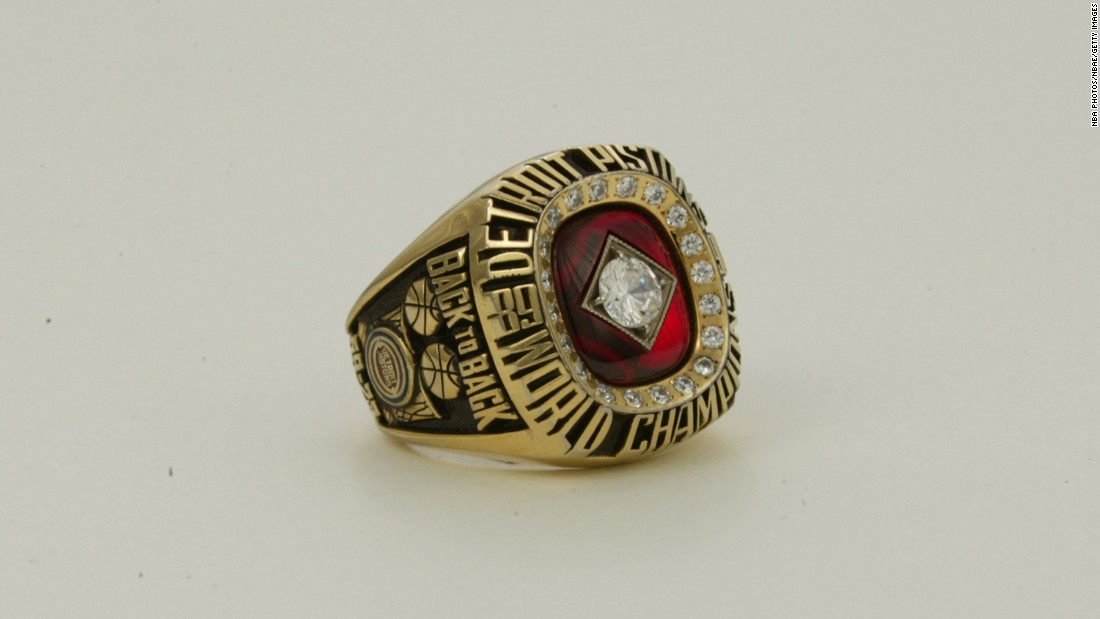 The ring for the 1989-90 Detroit Pistons featured a large diamond surrounded by 20 smaller diamonds. On the side of the ring are the words &quot;back to back&quot; -- signifying the team&#39;s consecutive championships.