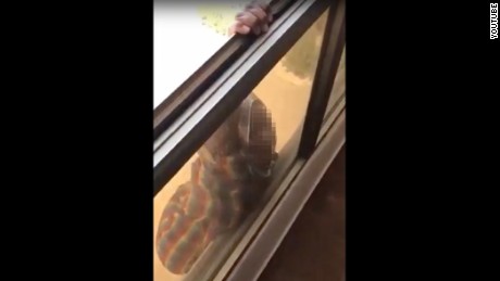 A Kuwaiti woman filmed her domestic worker hanging out of a window pleading for help.