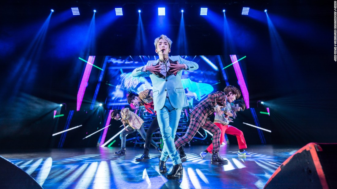 Kim Ki Bum, known as &quot;Key,&quot; sings in the front of the rest of the SHINee band in Dallas.