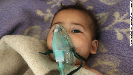A Syrian child receives treatment following a suspected toxic gas attack in Khan Sheikhun, a rebel-held town in the northwestern Syrian Idlib province, on April 4, 2017.
Warplanes carried out a suspected toxic gas attack that killed at least 35 people including several children, a monitoring group said. The Syrian Observatory for Human Rights said those killed in the town of Khan Sheikhun, in Idlib province, had died from the effects of the gas, adding that dozens more suffered respiratory problems and other symptoms.
 / AFP PHOTO / Mohamed al-Bakour        (Photo credit should read MOHAMED AL-BAKOUR/AFP/Getty Images)