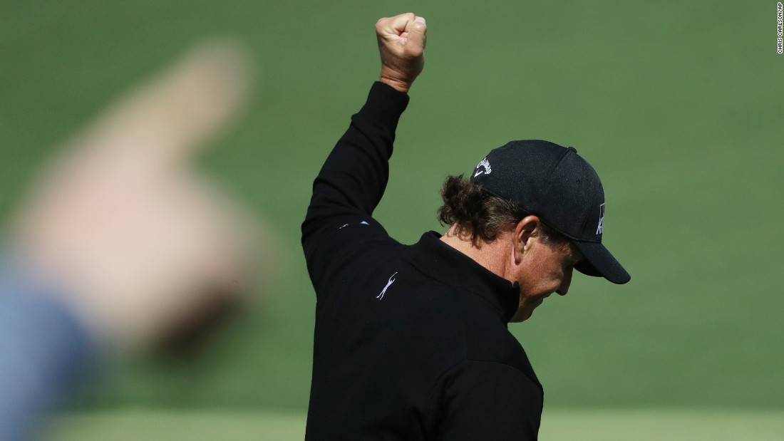 Phil Mickelson reacts after making an eagle on the second hole Thursday. Mickelson, who has won the Masters three times, shot a 1-under 71.