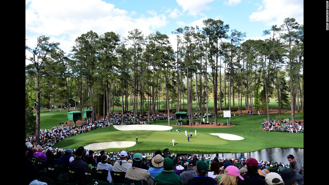 The crowd watches Jason Dufner, Ernie Els and Bernd Wiesberger play the 16th hole on Thursday.