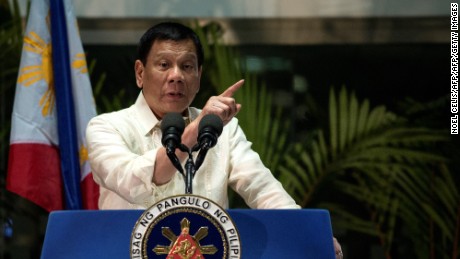 Philippine President Rodrigo Duterte gestures as he answers questions from the press at Manila International Airport on March 23, 2017.  
Duterte warned he may impose martial law and suspend elections for tens of thousands of local posts, fuelling concerns about democracy under his rule. Duterte said he was considering both measures as part of his controversial campaign to eradicate illegal drugs in society, and that martial law would also solve a range of other security threats. / AFP PHOTO / NOEL CELIS        (Photo credit should read NOEL CELIS/AFP/Getty Images)