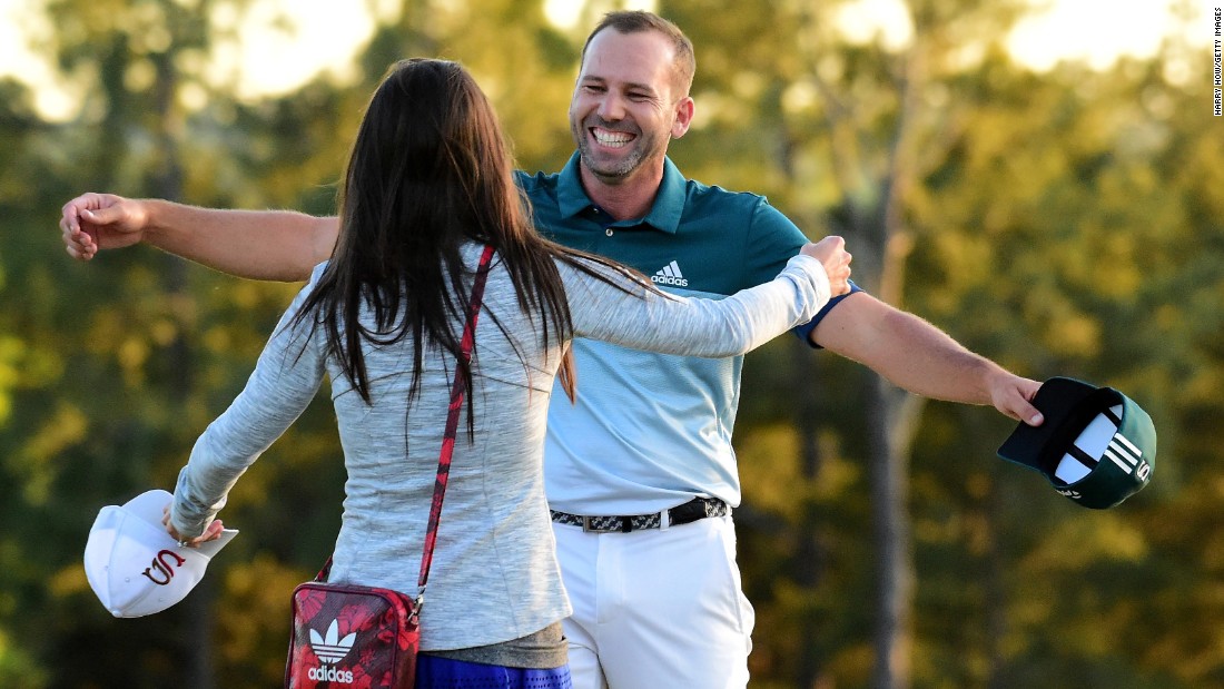 Garcia embraces fiancee Angela Akins after winning his first major title in a playoff with England&#39;s Justin Rose for the Masters.
