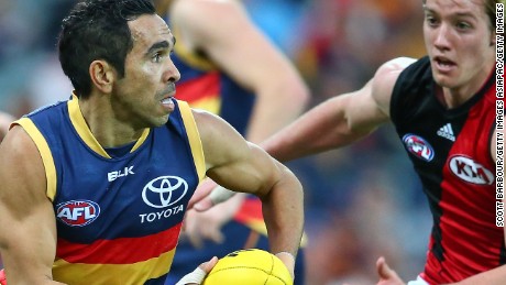 Eddie Betts runs with the ball during a match between the Adelaide Crows and the Essendon Bombers