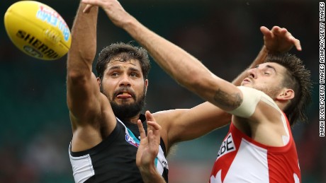 Paddy Ryder of the Power and Sam Naismith of the Swans compete for the ball during the round one AFL match between the Sydney Swans and the Port Adelaide Power