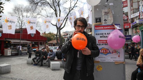 A supporter from Turkey&#39;s pro-Kurdish political opposition party, the Peoples&#39; Democratic Party (HDP), blows up a &quot;Hayir&quot; or &quot;No&quot; balloon at party tent in the middle of Istanbul on Sunday, April 9, 2017.