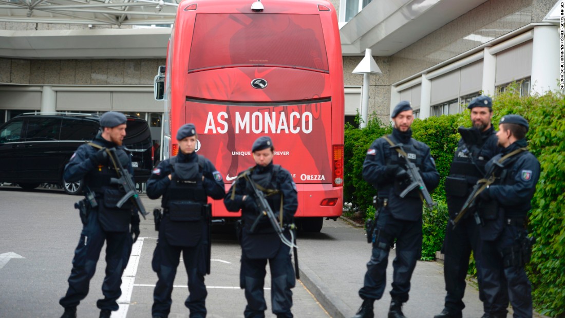 Policemen stood guard in front of a Monaco team bus Wednesday before the rescheduled Champions League encounter as security was tightened. &lt;br /&gt;