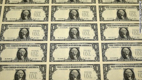 A sheet of freshly printed one dollar bills is ready for inspection at the Bureau of Engraving and Printing on March 24, 2015  in Washington, DC.