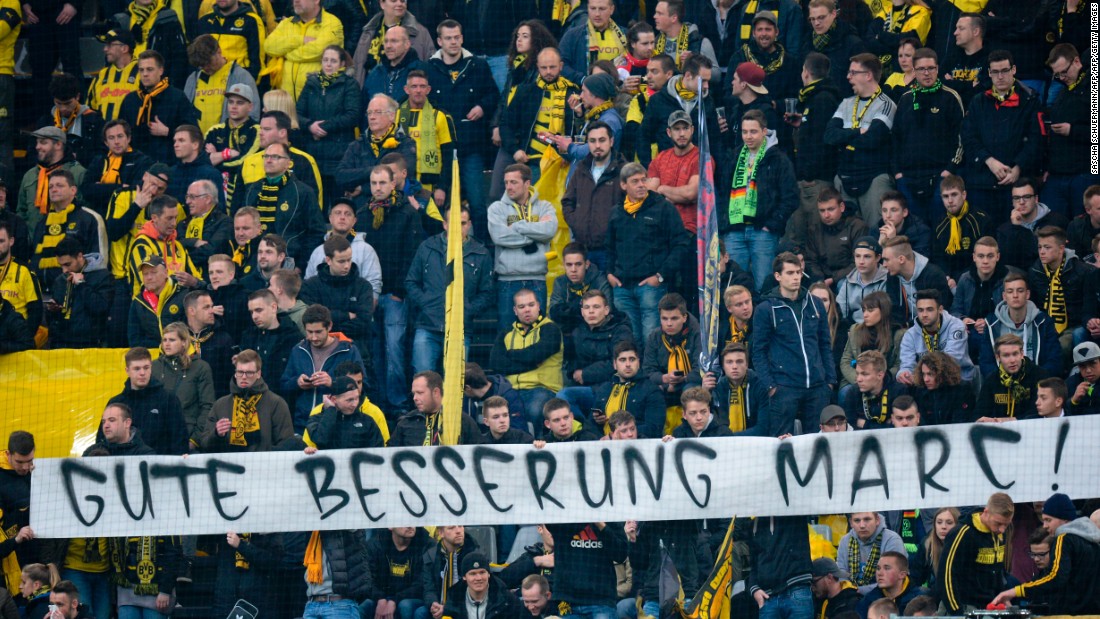 Dortmund fans displayed a banner with a message to their Spanish defender, who underwent surgery on his injured arm and hand, which read &quot;Get well Marc.&quot;
