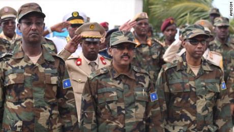 The president of Somalia, Mohamed Abdullahi Mohamed Farmaajo (center) receives a guard of honor during a ceremony to mark the 57th Anniversary of the Somali National Army held at the Ministry of defense in Mogadishu Wednesday 