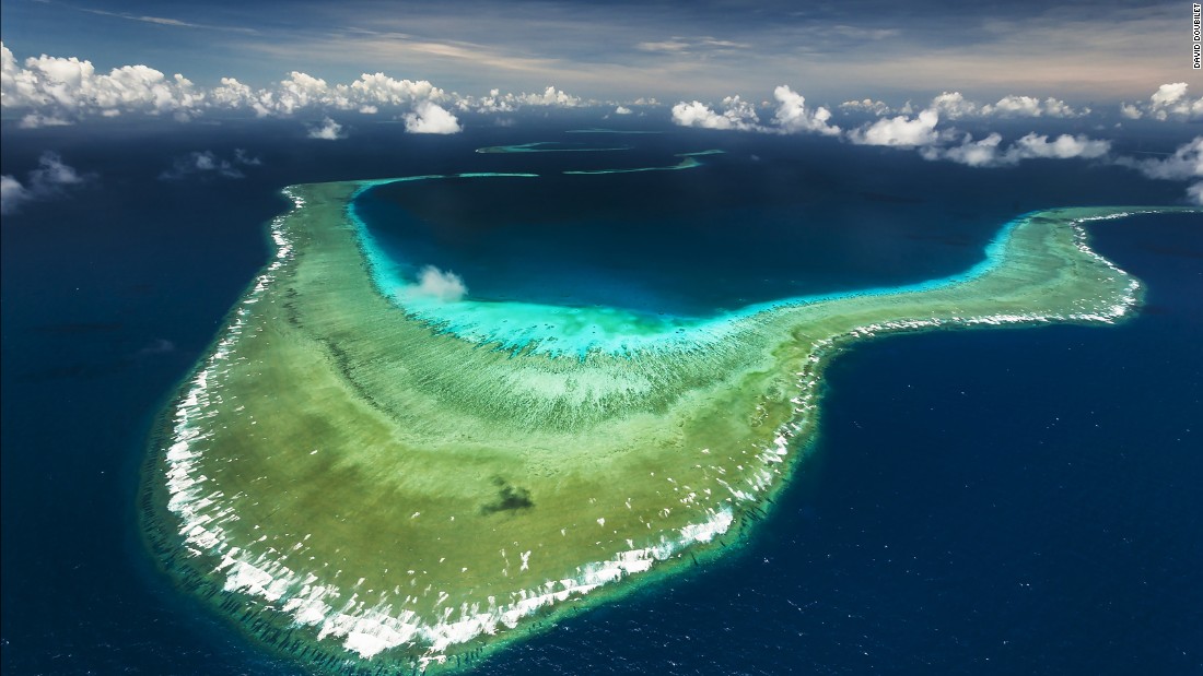 An aerial view of Great Detached Reef on the Northern Great Barrier Reef.  Great Detached Reef is a actually a number of reefs supported by a fossil mountain range. 