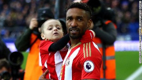 Lowery is carried out by Defoe prior to Sunderland&#39;s match against Everton at Goodison Park in Feburary.