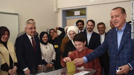 Turkish President Recep Tayyip Erdogan casts his vote accompanied by his wife Emine Erdogan at a polling station in the Uskudar district of Istanbul.
