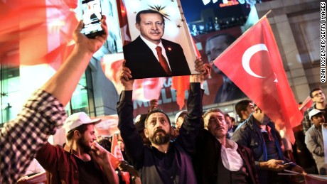 A supporter of the &quot;yes&quot; brandishes a picture of Turkish president Recep Tayyip Erdogan.