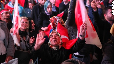 Supporters of President Erdogan celebrate the result.