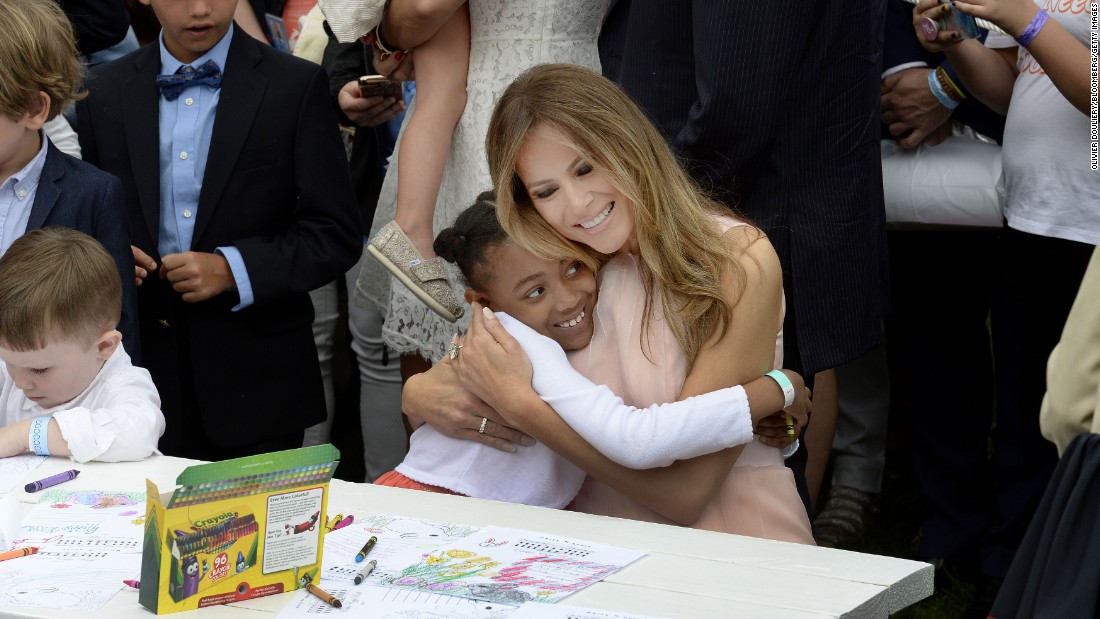 The first lady hugs a child at the annual &lt;a href=&quot;http://www.cnn.com/2017/04/17/politics/white-house-easter-egg-roll/&quot; target=&quot;_blank&quot;&gt;White House Easter Egg Roll&lt;/a&gt; in April 2017. They were making cards for members of the US military.