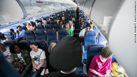 Captain Erich Ries shares travel tips during a &quot;Wings for Autism&quot; event at the airport in Atlanta.