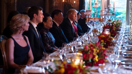 TOPSHOT - US President Donald Trump (C) and Chinese President Xi Jinping (L) look on during dinner at the Mar-a-Lago estate in West Palm Beach, Florida, on April 6, 2017. / AFP PHOTO / JIM WATSON        (Photo credit should read JIM WATSON/AFP/Getty Images)