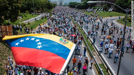 Thousands of people rally against Venezuelan President Nicolas Maduro along the Francisco Fajardo highway in eastern Caracas.
