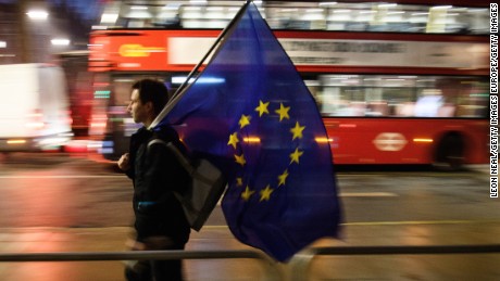 LONDON, ENGLAND - JANUARY 24:  A man carries a European Union flag outside the Supreme Court in Parliament Square ahead of the ruling on whether Parliament have the power to begin the Brexit process, on January 24, 2017 in London, England. The judgement will play an important role in how the Government proceeds with it&#39;s planned use of the EU&#39;s Article 50 exit clause.  (Photo by Leon Neal/Getty Images)