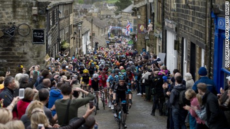 Cylists ride on a cobblestone street through the village of Haworth as they take part on the third and final day of the inaugural &#39;Tour de Yorkshire&#39; in Haworth on May 3, 2015. 
 AFP PHOTO / OLI SCARFF        (Photo credit should read OLI SCARFF/AFP/Getty Images)