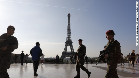 Soldiers guard the Eiffel Tower area in Paris on Sunday as security is stepped up for the presidential vote.