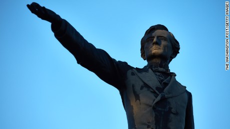 New Orleans&#39;  Jefferson Davis statue towers over the street also named for the Confederate President.