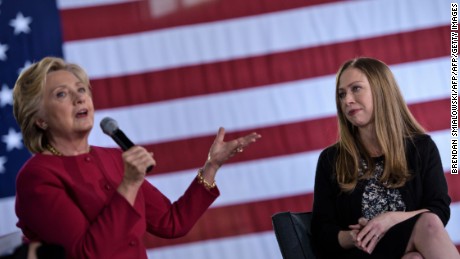 Chelsea Clinton (R) listens as Democratic presidential nominee Hillary Clinton speaks during a town hall meeting October 4, 2016 in Haverford, Pennsylvania. / AFP / Brendan Smialowski        (Photo credit should read BRENDAN SMIALOWSKI/AFP/Getty Images)