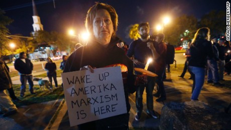 Dana Farley of New Orleans participates in a candlelight vigil at the statue of Jefferson Davis in New Orleans on Monday, April 24, 2017. 