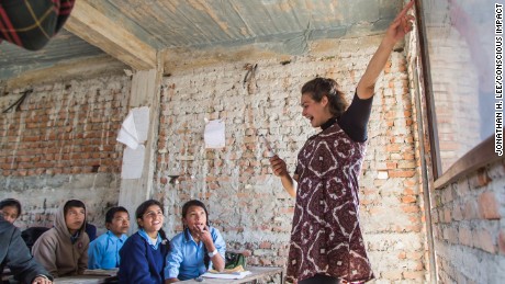 Ellen Stewart, a Conscious Impact volunteer, teaches 7th graders about environmental awareness at the Nawalpur Secondary School.