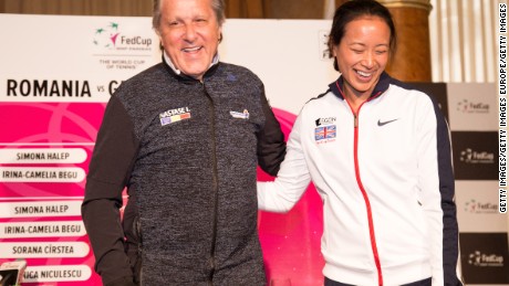 Ilie Nastase and Anne Keothavong posing for photos at the start of theFed Cup tie between Great Britain and Romania. 