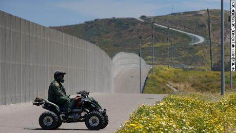 A Border Patrol agent keeps watch at the US-Mexico border at San Ysidro, California, in April 2017.