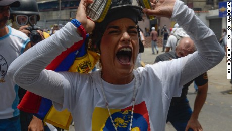 TOPSHOT - Lilian Tintori, wife of jailed Venezuelan opposition leader Leopoldo Lopez, gestures during a protest against Venezuelan President Nicolas Maduro, in Caracas on April 19, 2017.
Venezuela braced for rival demonstrations Wednesday for and against President Nicolas Maduro, whose push to tighten his grip on power has triggered waves of deadly unrest that have escalated the country&#39;s political and economic crisis. / AFP PHOTO / FEDERICO PARRA        (Photo credit should read FEDERICO PARRA/AFP/Getty Images)