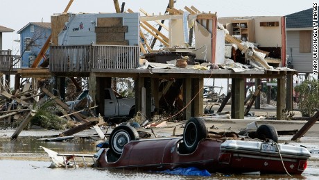 CRYSTAL BEACH, TX - SEPTEMBER 17: A home and a car lie destroyed by Hurricane Ike September 17, 2008 in Crystal Beach, Texas. Hurricane Ike caused widespread damage and power outages on the Texas coast.  (Photo by Mark Wilson/Getty Images)